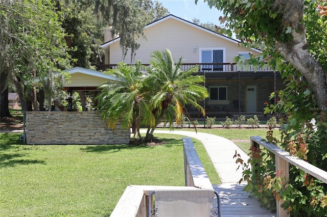 12929 Sugar Creek Blvd, Hudson, FL 34669 - rear view of house featuring a yard and a deck