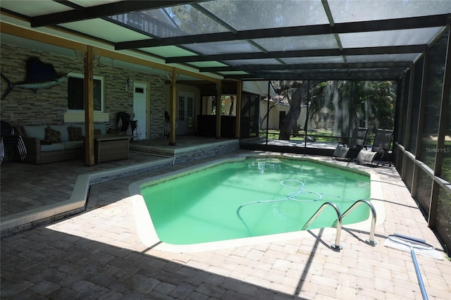 12929 Sugar Creek Blvd, Hudson, FL 34669 - outdoor pool featuring a patio, outdoor lounge area, french doors, and glass enclosure