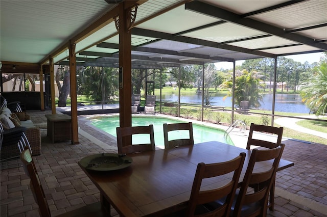 12929 Sugar Creek Blvd, Hudson, FL 34669 - view of patio / terrace featuring a water view, an outdoor pool, a lanai, and view of scattered trees
