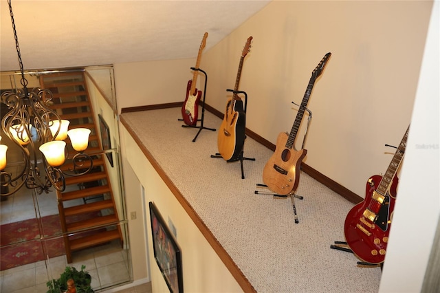 12929 Sugar Creek Blvd, Hudson, FL 34669 - stairway featuring a chandelier and baseboards