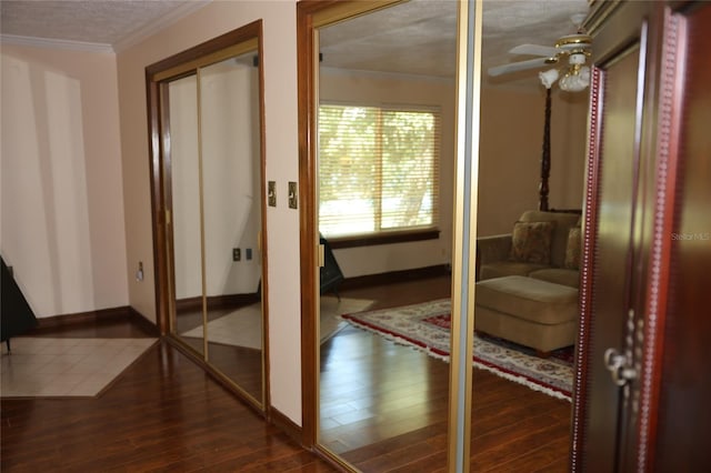 12929 Sugar Creek Blvd, Hudson, FL 34669 - hall featuring dark wood-style floors, ornamental molding, and baseboards