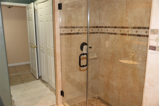 12929 Sugar Creek Blvd, Hudson, FL 34669 - bathroom featuring a shower stall, tile patterned floors, and baseboards