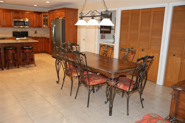 12929 Sugar Creek Blvd, Hudson, FL 34669 - dining area featuring light tile patterned flooring, recessed lighting, and ornamental molding