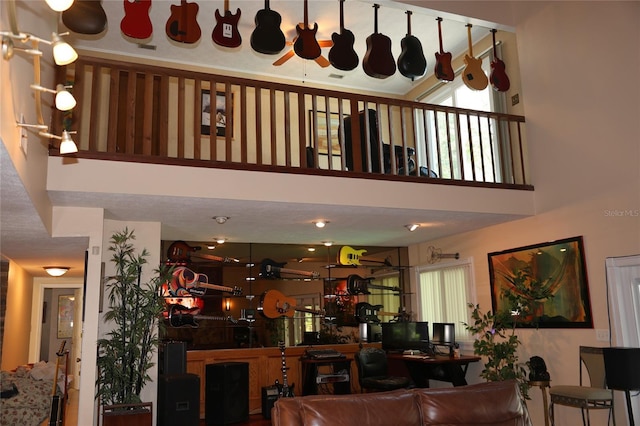 12929 Sugar Creek Blvd, Hudson, FL 34669 - living room with a ceiling fan and a high ceiling