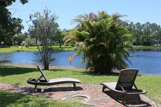 12929 Sugar Creek Blvd, Hudson, FL 34669 - view of community featuring a water view and a lawn