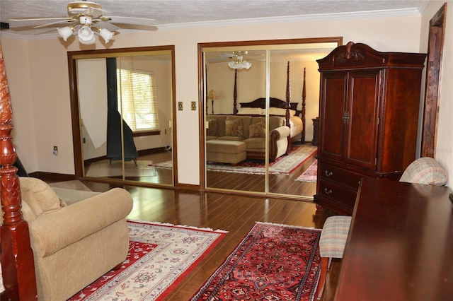 12929 Sugar Creek Blvd, Hudson, FL 34669 - bedroom with multiple closets, hardwood / wood-style flooring, ornamental molding, baseboards, and ceiling fan