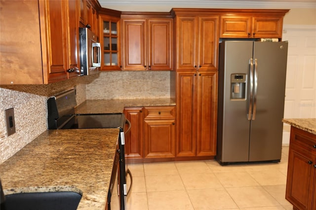 12929 Sugar Creek Blvd, Hudson, FL 34669 - kitchen featuring stainless steel appliances, light stone countertops, decorative backsplash, brown cabinets, and crown molding