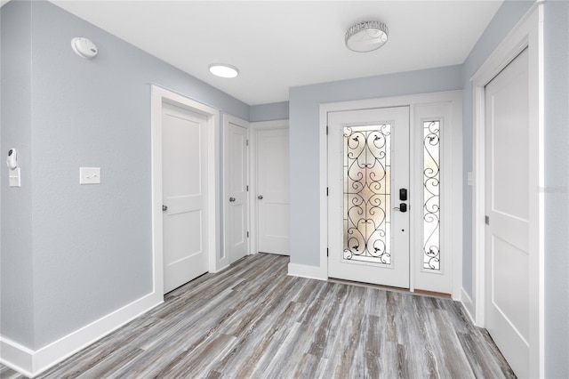 9909 San Mateo Way, Port Richey, FL 34668 - entryway with light wood-type flooring and baseboards