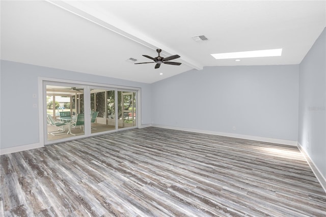9909 San Mateo Way, Port Richey, FL 34668 - unfurnished room featuring wood finished floors, ceiling fan, a skylight, and baseboards