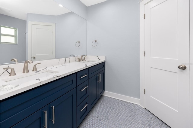 9909 San Mateo Way, Port Richey, FL 34668 - full bath with double vanity and baseboards