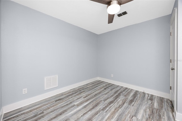 9909 San Mateo Way, Port Richey, FL 34668 - spare room featuring wood finished floors, a ceiling fan, and baseboards