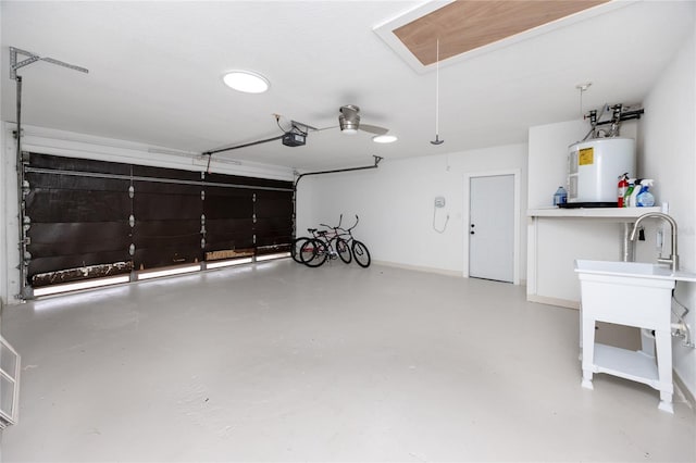 9909 San Mateo Way, Port Richey, FL 34668 - garage featuring electric water heater, a garage door opener, and baseboards