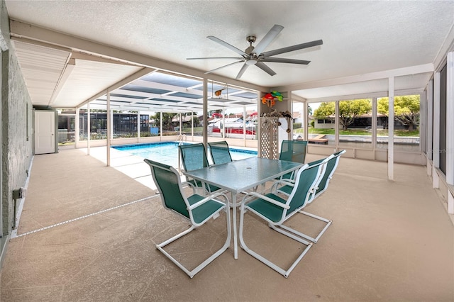 9909 San Mateo Way, Port Richey, FL 34668 - swimming pool featuring a patio and a ceiling fan
