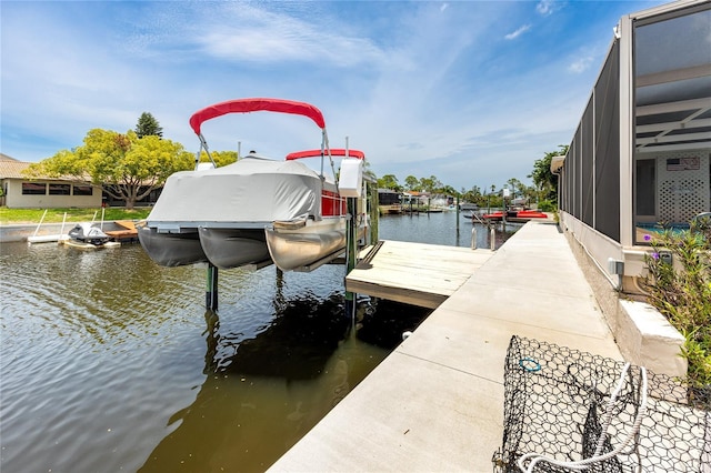 9909 San Mateo Way, Port Richey, FL 34668 - dock featuring boat lift and a water view