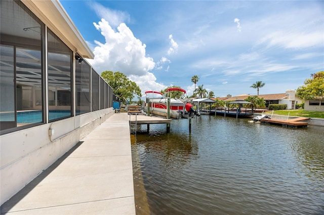 9909 San Mateo Way, Port Richey, FL 34668 - dock area featuring a water view, boat lift, and glass enclosure