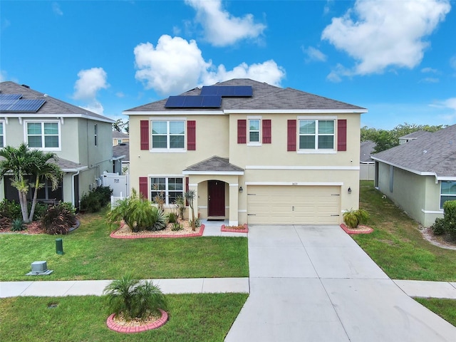 14135 Arbor Pines Dr, Riverview, FL 33579 - traditional home with stucco siding, roof mounted solar panels, a garage, concrete driveway, and a front lawn