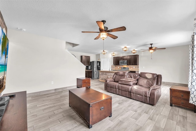 14135 Arbor Pines Dr, Riverview, FL 33579 - living room with a ceiling fan and light wood-type flooring