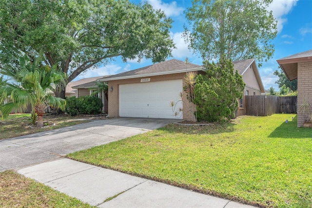 11816 Cedarfield Dr, Riverview, FL 33579 - ranch-style house with an attached garage, driveway, brick siding, and a shingled roof
