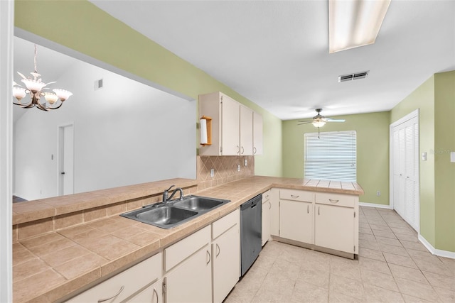 11816 Cedarfield Dr, Riverview, FL 33579 - kitchen with dishwasher, a peninsula, a sink, tasteful backsplash, and a chandelier