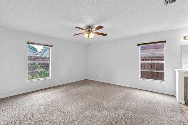 11816 Cedarfield Dr, Riverview, FL 33579 - carpeted spare room featuring a ceiling fan, baseboards, and a textured ceiling