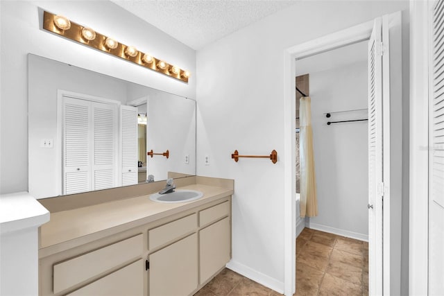 11816 Cedarfield Dr, Riverview, FL 33579 - full bath featuring a closet, vanity, a textured ceiling, baseboards, and shower / bathtub combination with curtain