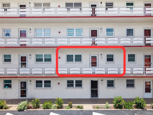 3114 59th St S Unit 203, Gulfport, FL 33707 - view of building exterior with uncovered parking
