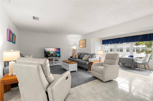 3114 59th St S Unit 203, Gulfport, FL 33707 - living room with a textured ceiling