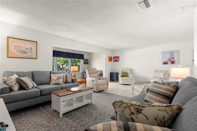 3114 59th St S Unit 203, Gulfport, FL 33707 - living area with a textured ceiling