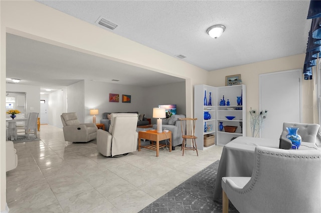3114 59th St S Unit 203, Gulfport, FL 33707 - living area with a textured ceiling