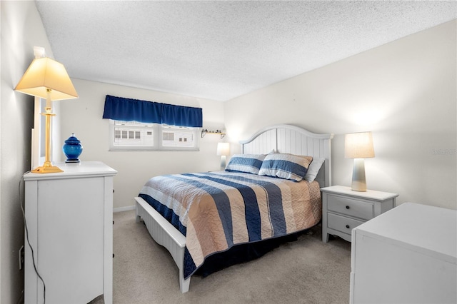 3114 59th St S Unit 203, Gulfport, FL 33707 - bedroom featuring carpet flooring and a textured ceiling