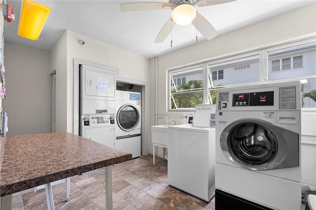 3114 59th St S Unit 203, Gulfport, FL 33707 - community laundry featuring stacked washer / drying machine, washer and clothes dryer, and a ceiling fan