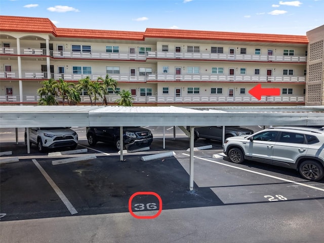 3114 59th St S Unit 203, Gulfport, FL 33707 - view of apartment building / complex featuring covered parking