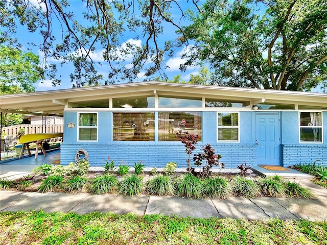6700 14th St N, Saint Petersburg, FL 33702 - view of front of house with brick siding and an attached carport