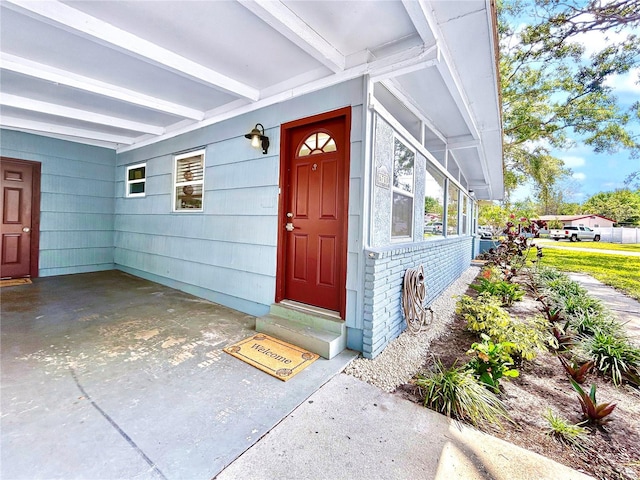 6700 14th St N, Saint Petersburg, FL 33702 - entrance to property with brick siding and a carport