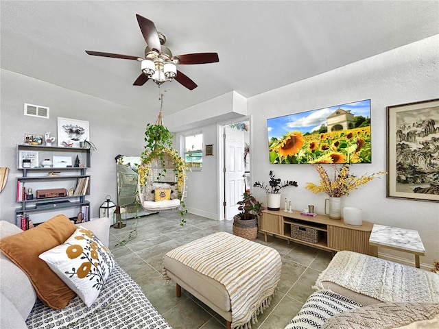 6700 14th St N, Saint Petersburg, FL 33702 - tiled living room featuring a ceiling fan and baseboards