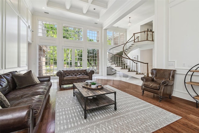 16502 Millan De Avila, Tampa, FL 33613 - living area featuring wood finished floors, beam ceiling, a towering ceiling, stairway, and ornamental molding