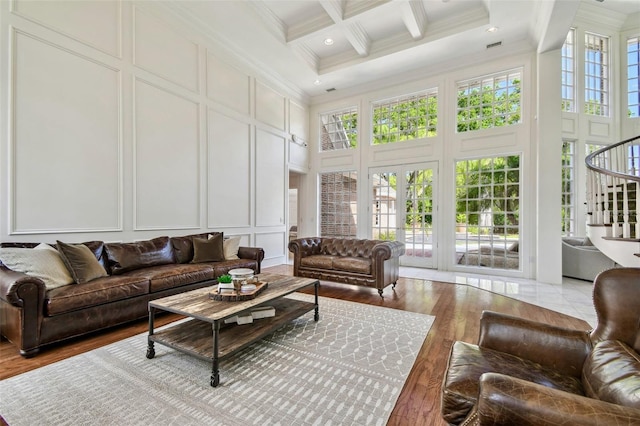 16502 Millan De Avila, Tampa, FL 33613 - living area with a decorative wall, a towering ceiling, crown molding, beam ceiling, and coffered ceiling