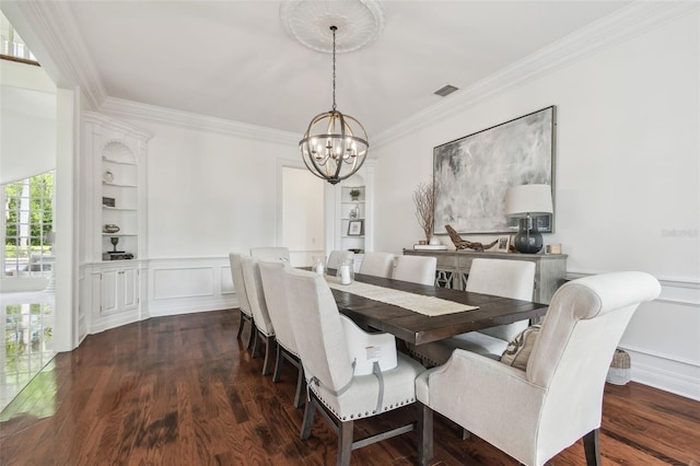 16502 Millan De Avila, Tampa, FL 33613 - dining space featuring a chandelier, crown molding, wood finished floors, a decorative wall, and a wainscoted wall