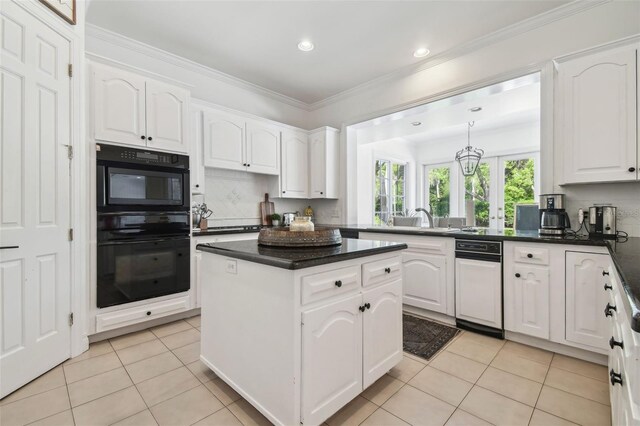 16502 Millan De Avila, Tampa, FL 33613 - kitchen with dark countertops, a kitchen island, light tile patterned floors, white cabinets, and recessed lighting