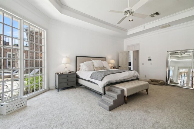 16502 Millan De Avila, Tampa, FL 33613 - carpeted bedroom with a tray ceiling, crown molding, ceiling fan, and baseboards