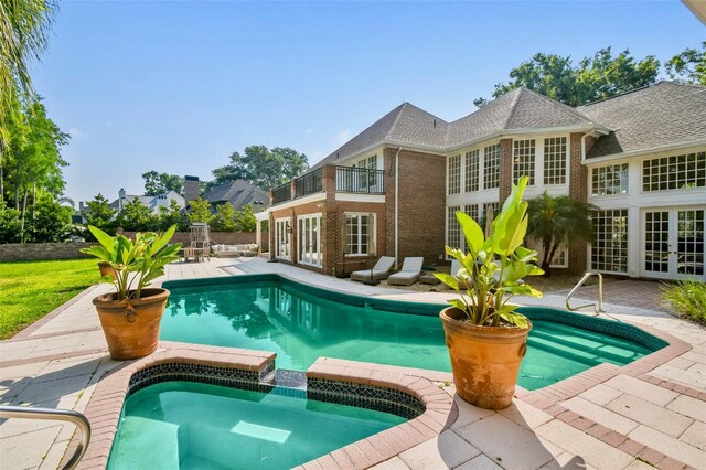 16502 Millan De Avila, Tampa, FL 33613 - swimming pool with french doors and a patio area
