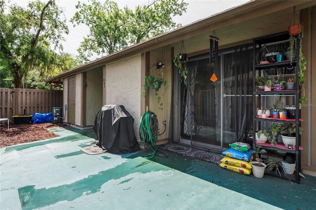 802 Antler Ct, Brandon, FL 33511 - property entrance featuring stucco siding and a patio