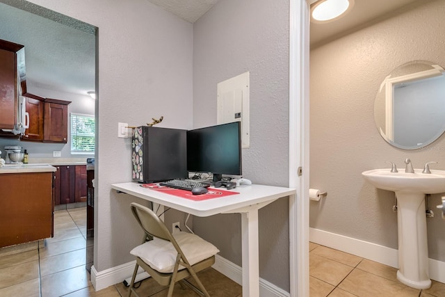 1403 W Pradera Ave, Tampa, FL 33612 - office with light tile patterned flooring and baseboards