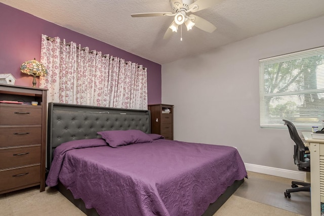 1403 W Pradera Ave, Tampa, FL 33612 - carpeted bedroom with baseboards, a desk, and ceiling fan