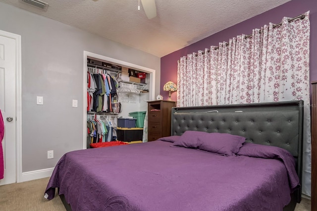 1403 W Pradera Ave, Tampa, FL 33612 - bedroom with carpet, a closet, ceiling fan, baseboards, and a textured ceiling
