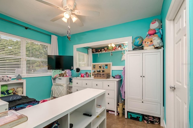 1403 W Pradera Ave, Tampa, FL 33612 - home office featuring ceiling fan and light tile patterned floors