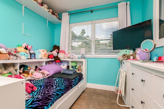 1403 W Pradera Ave, Tampa, FL 33612 - tiled bedroom with baseboards