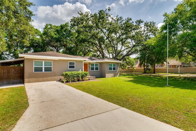 1403 W Pradera Ave, Tampa, FL 33612 - view of front of home with driveway and stucco siding