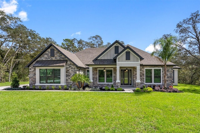 17404 Nokota Ave, Hudson, FL 34667 - craftsman-style home featuring stone siding, a front yard, and board and batten siding