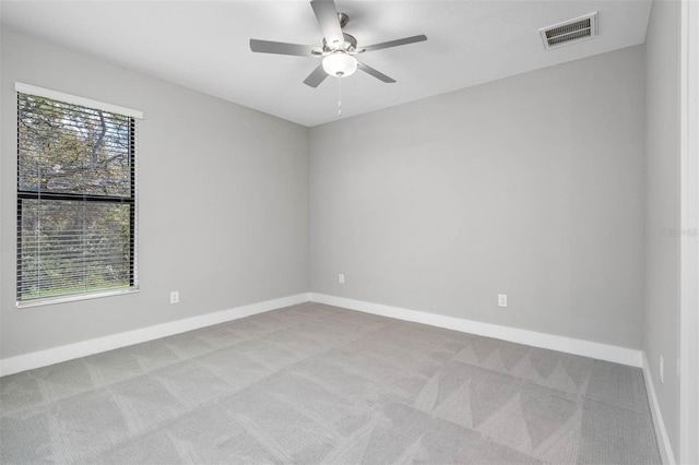 17404 Nokota Ave, Hudson, FL 34667 - spare room with carpet floors, ceiling fan, and baseboards